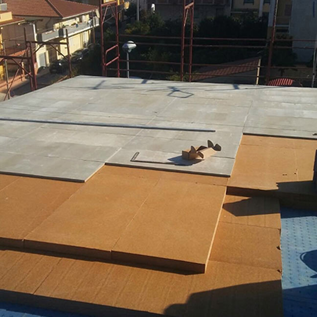 Roof with cement bonded particle board